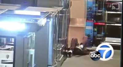 Man eating Cheetos sucker punches someone inside a Best Buy and steals their phone.