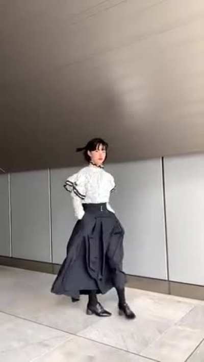 Showing the new clothes that she made