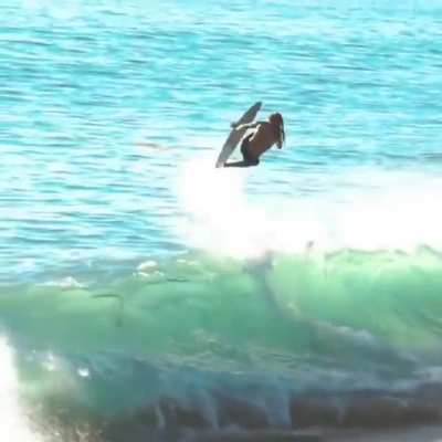 This surfer jumping the wave