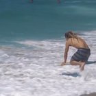 This dude skimboarding