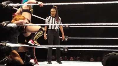 Becky taking a deep stinkface from Asuka!