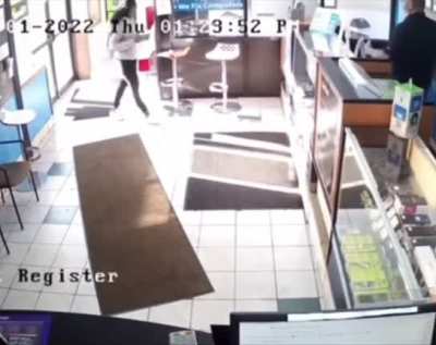 Woman tries running out of the store without paying after getting her phone fixes