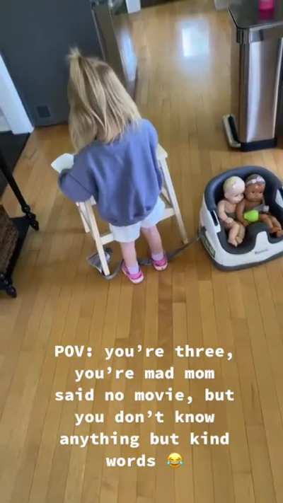 She's having a tantrum, but only knows kind words, so she shouts them at her mum.