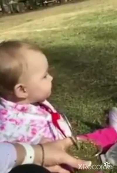 Baby tries herbal tea for the first time