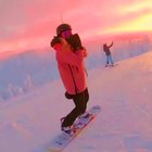 Beautiful snowboarding in winter wonderland sunset