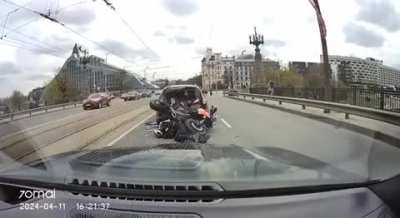 Riga, Latvia - Speeding motorcyclist gets crushed between his bike and a car.