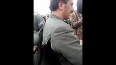 Musician crying as he is forced to watch his musical instruments set on fire in Afghanistan