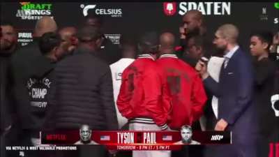 Mike Tyson slaps Jake Paul during their weigh-in, Jake Paul responds in the mic with cringe