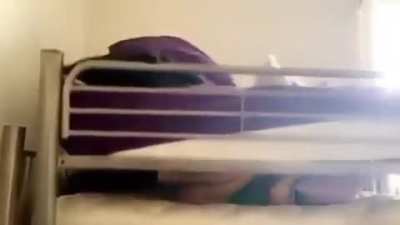 trying to lift a bunk bed while lying under it?