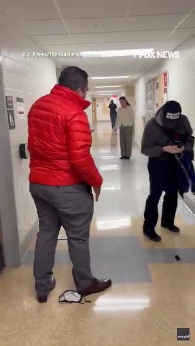 An Ohio State University professor tackled a TV cameraman to the ground simply for asking questions about Epstein.