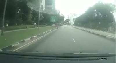 cyclist makes abrupt turn infront of car and then proceeds through red light