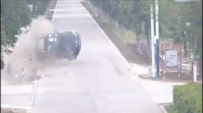 Car swipes the back of a minivan at an intersection, causing it to flip over and hurling its passengers out