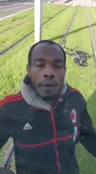 Guy on a bicycle gets mad at tram following him