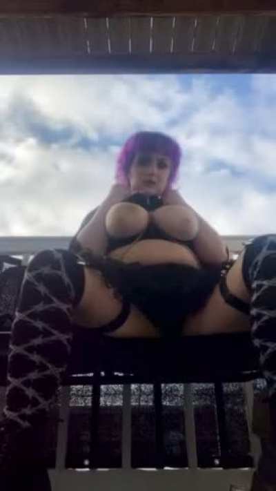 Goth babe pulling out her heavy hangers on the park bench!