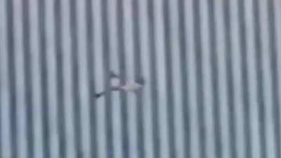 Possibly the clearest and most disturbing video of a 9/11 jumper victim falling (video stabilized)