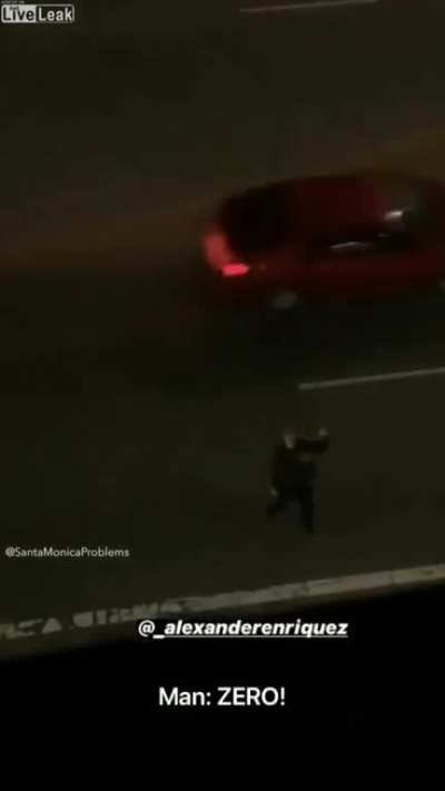 Man on road threatening a building gets hit by a car