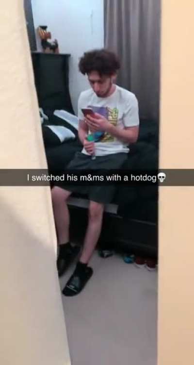 Guy switches his friends m&ms out for a hotdog