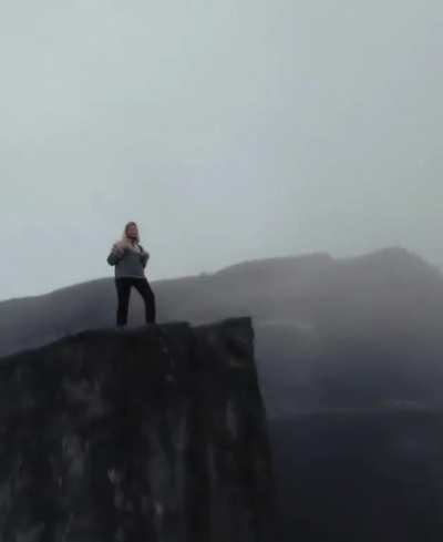 Amazing camerawork circling edge of cliff