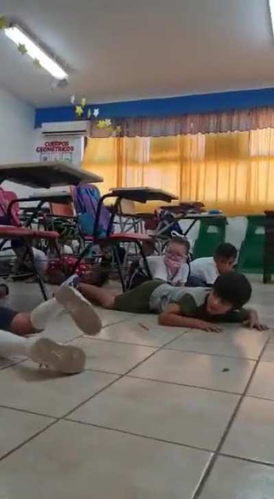 Video shows school children duck and hide during cartel shootout in Mexico