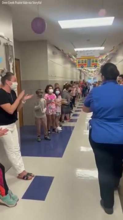Students and staff at an Oklahoma elementary school lined the hallways to cheer for their school cafeteria manager who passed her test to become a U.S. citizen.