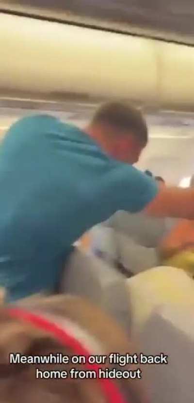 Man tried to open the door on a crowded Ryanair plane flying from Zadar in Croatia. When he ran to the door, two young men jumped on him and threw him to the floor.