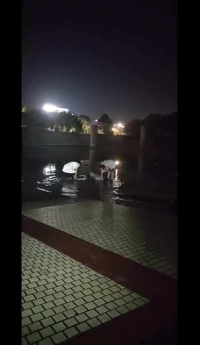 Lightning strikes tower in Anhui, China, killing 2 and injuring 7 standing in puddles around the tower.