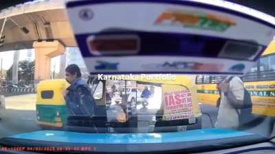 Auto Rickshaw driver first tried to make a sharp turn and then argued with driver.