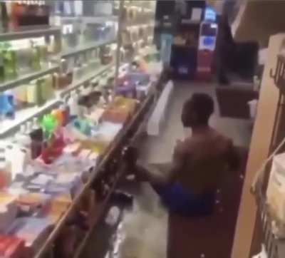 Dude tweaking and smashing bottles on his own head