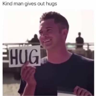 Kind man gives out hugs