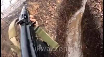 Ukrainian soldier defending his muddy trench position using indirect RPG fire and small arms fire. (Bakhmut, February 2023)