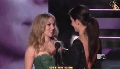 Scarlett Johansson kissing Sandra Bullock