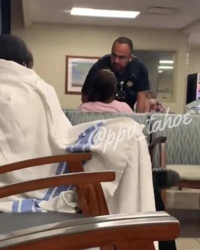 Officer scolds woman for belittling others at the hospital