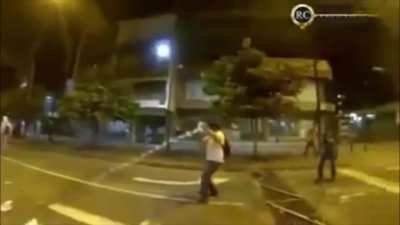 Guy catches tear gas canister mid air and throws it back.