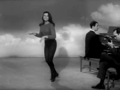Ann-Margret showing off her singing & dancing skills as part of personality test, 1961