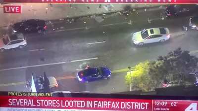 Just witnessed a looter lose her phone while looting in L.A. only to have it lifted by another looter later.