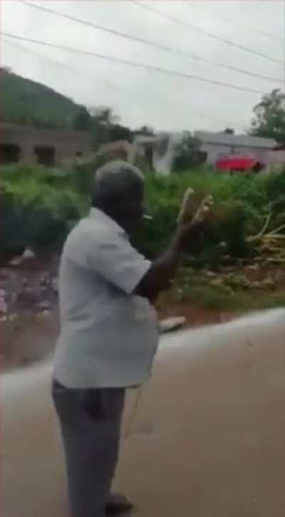 Man lighting fireworks with cigarette