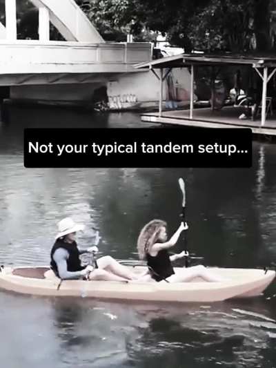 We built a 2-person kayak where one person paddles and the other rows — face to face