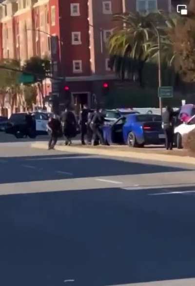 What started as a traffic stop in front of my apartment turned into a shootout causing people to flee from their cars.