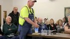 A farmer in Nebraska asking a pro-fracking committee member to honor his word of drinking water from a fracking location
