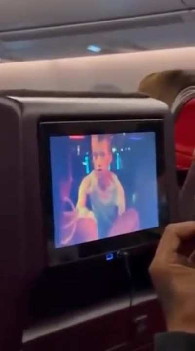 Kid enjoying some inflight entertainment.