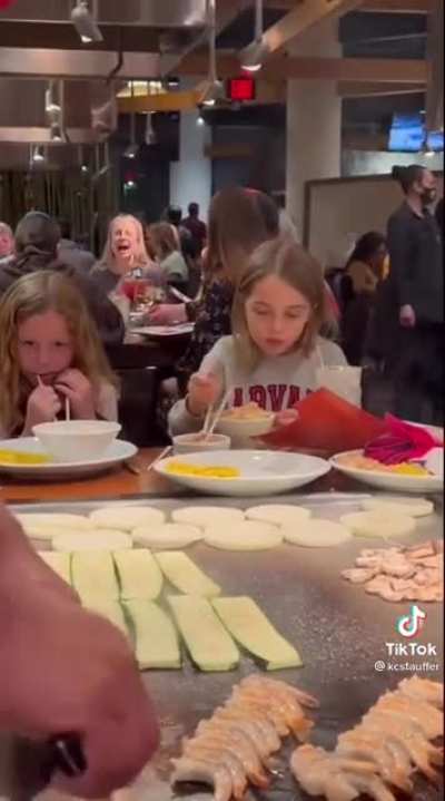 kids thinks she can understand Japanese because a Japanese man is speaking English to her