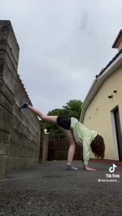 Laura being flexible in tight shorts