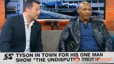 Mike Tyson destroys reporter.