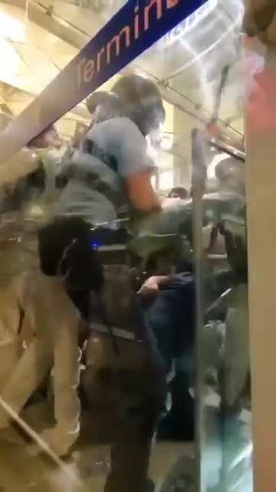 Policeman in hong kong tackels a woman to the ground and it backfires