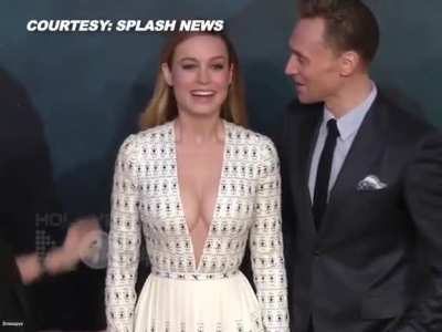 Brie Larson catches Tom Hiddleston staring at her cleavage.