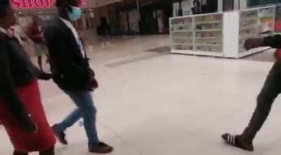 Oiled floor at South African shopping mall to quell looters