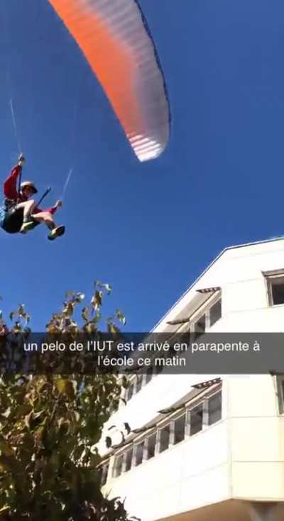 Guy goes to college in a paraglider