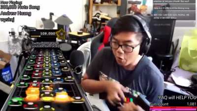 Acai nearly breaks guitar and fingers playing impossible song.