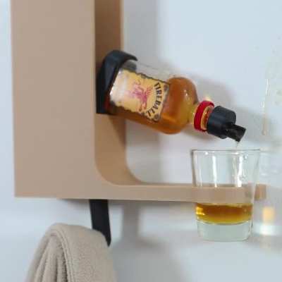 I design dumb product ideas so I built a coat hook that also pours you a shot.