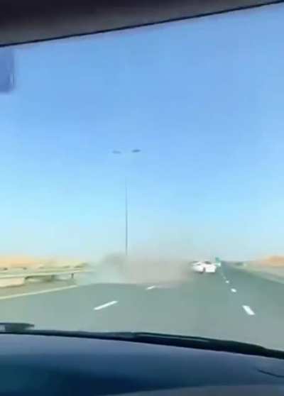 Tesla hitting a camel in the middle of the street, in Dubai.